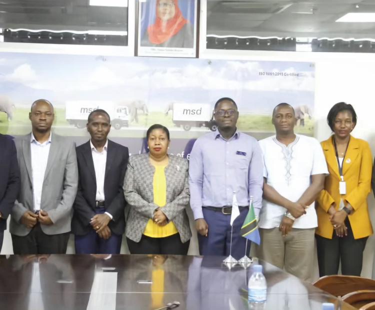 Message from the Medical Depot (MSD) in a Group Photo Message from the University of Dodoma (UDOM)