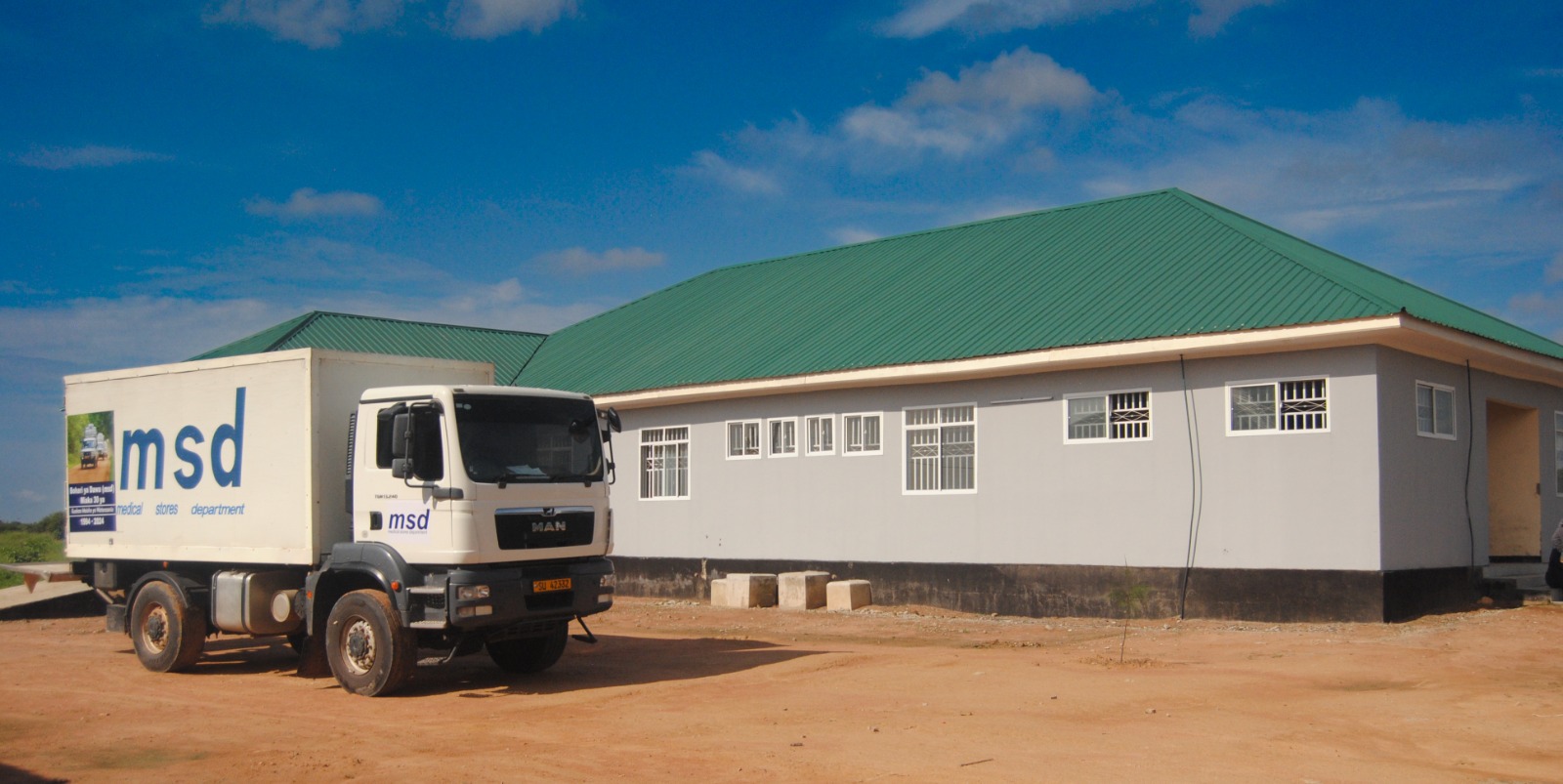 An MSD truck is parked at Itigi District Hospital, waiting to unload medical supplies.