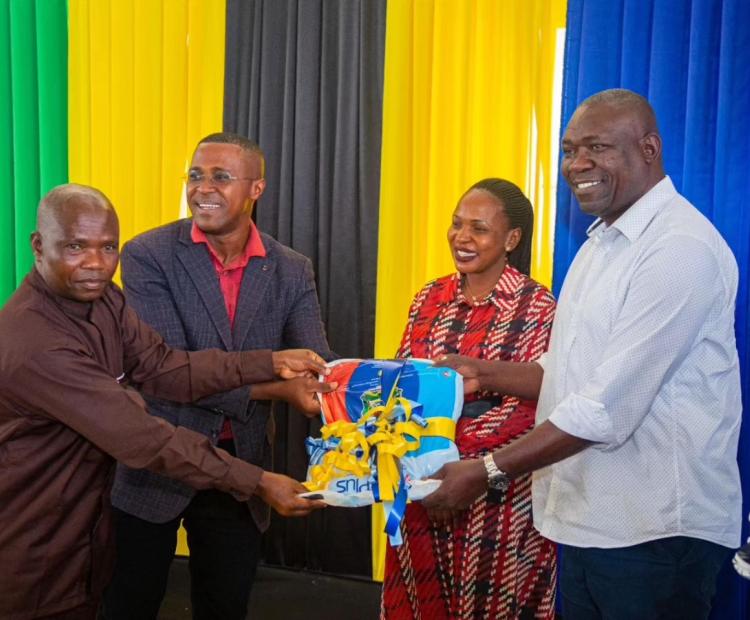 Songwe Regional Commissioner Dr. Francis Michael (right), Launching the Net Distribution Exercise in the Region, by Handing Over the Nets to Some of the Regional Executives.