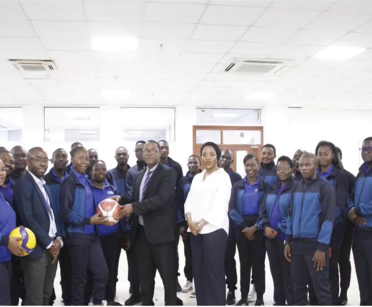 The Management of the Drug Depot (MSD) Presents the Flag to MSD Athletes, Shortly Before Participating in the SHIMUTA Championships