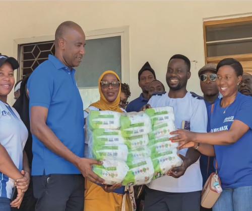Tanga Regional Manager Representative Mr. Grant Mwapele Presenting Assistance to the Leaders of the Ngamiani Health Center on behalf of the MSD Leadership